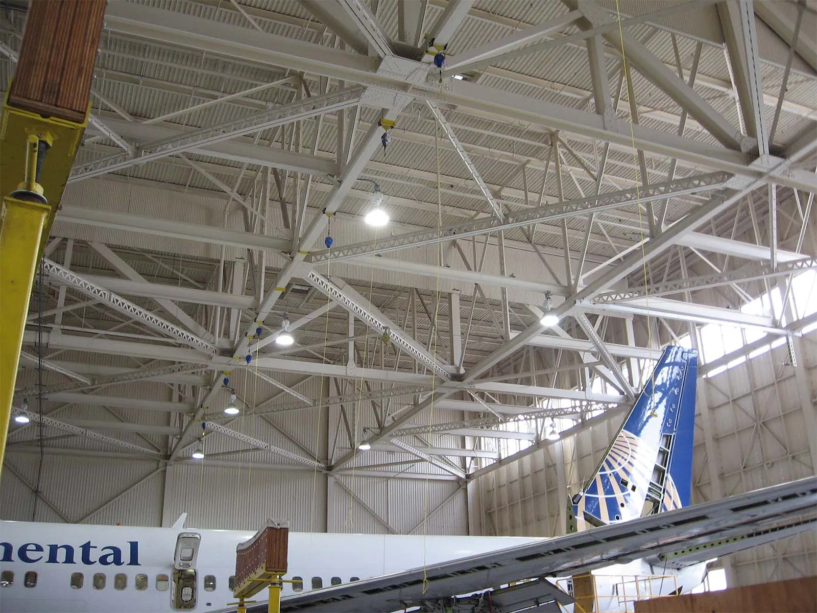Fall protection system installed in aircraft hangar for aerospace maintenance operations