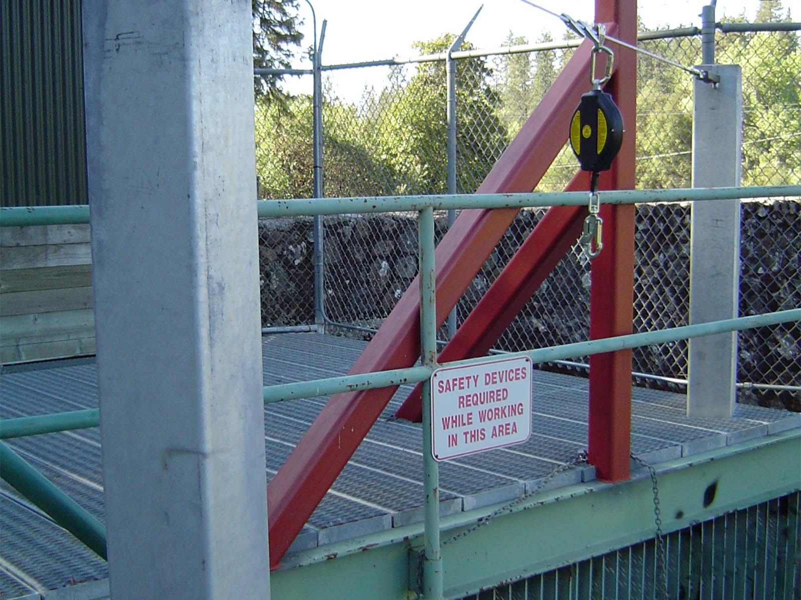 Engineered fall arrest system designed for elevated and hazardous access on bridges and dams