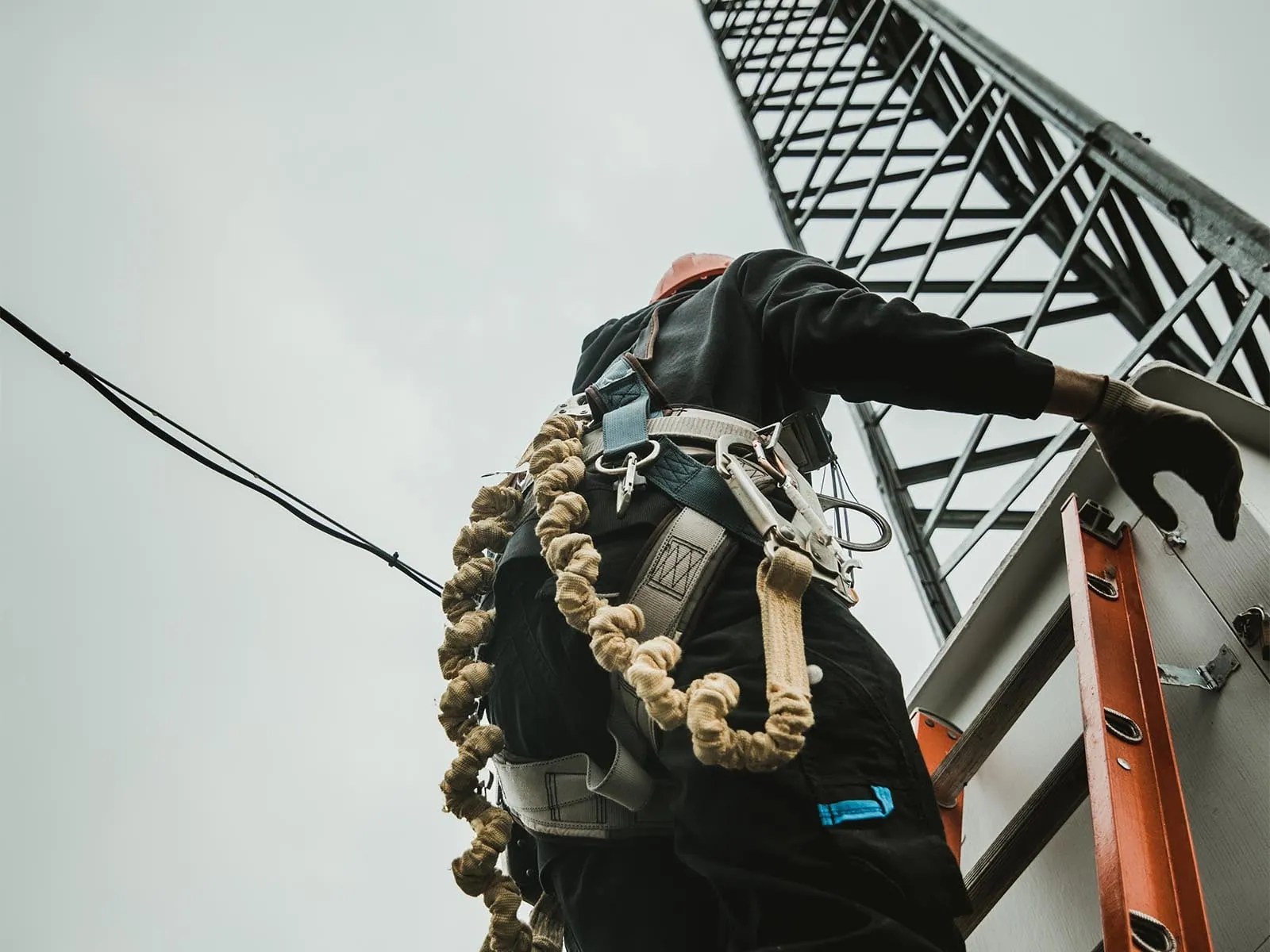 Fall protection system installed on communication tower for elevated access safety