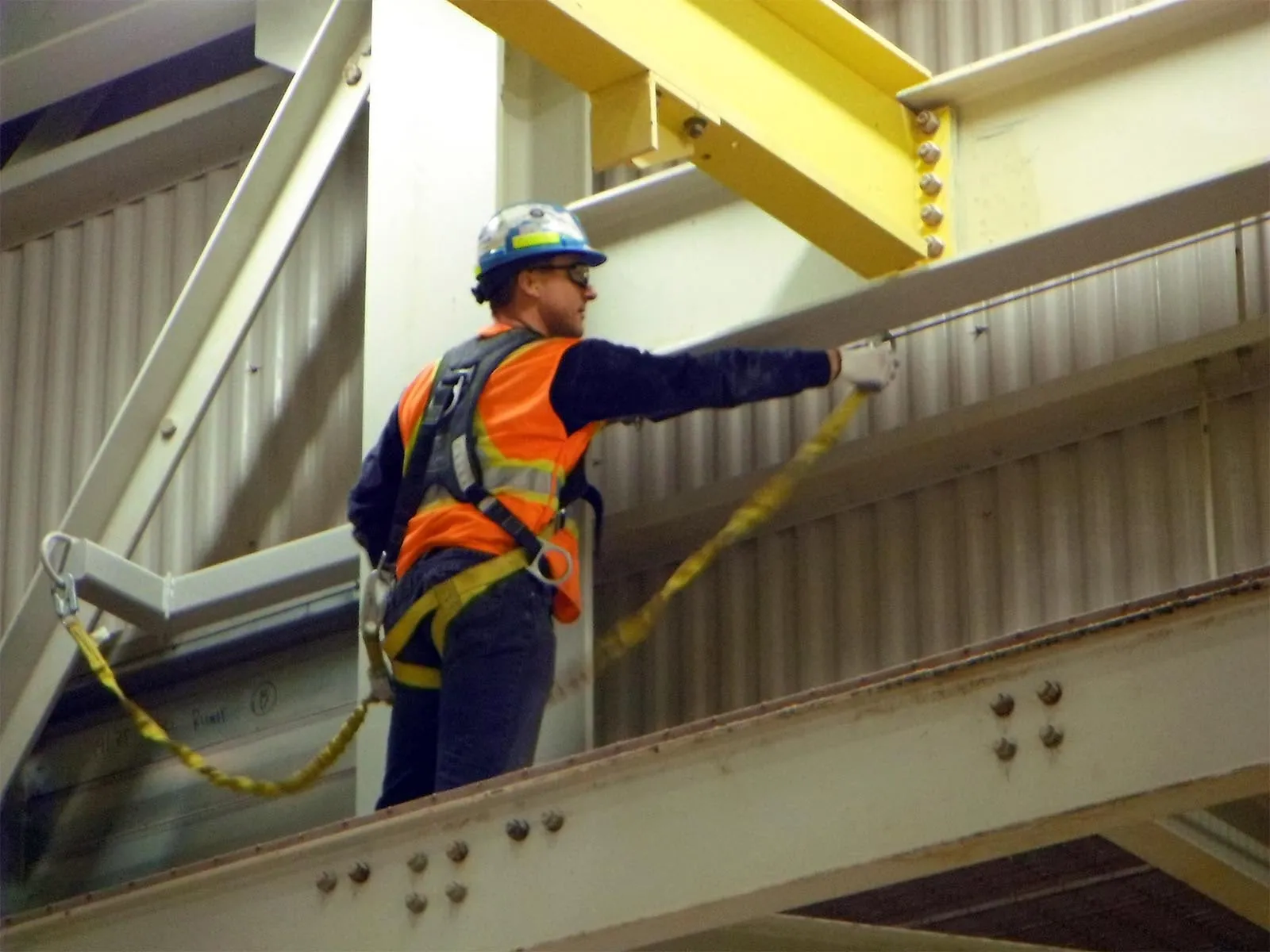 Rigid rail or lifeline system designed for safe access along crane runway