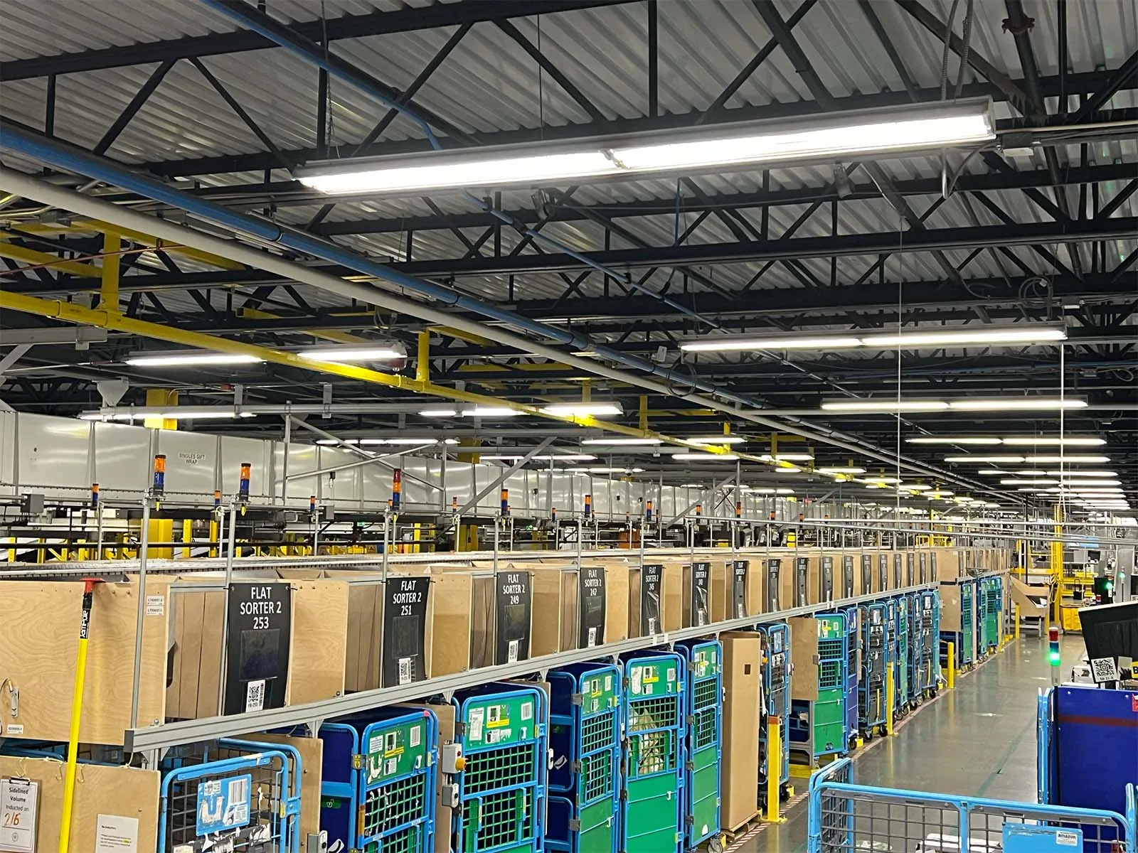 Engineered fall arrest system for conveyor access and overhead maintenance in distribution facility