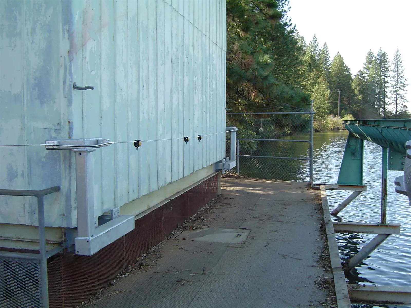 Construction worker secured with lifeline while working on bridge or elevated structure