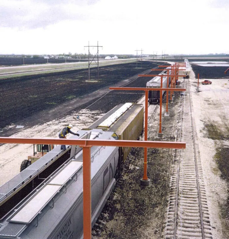 Engineered horizontal lifeline above a railcar loading position at a mine site
