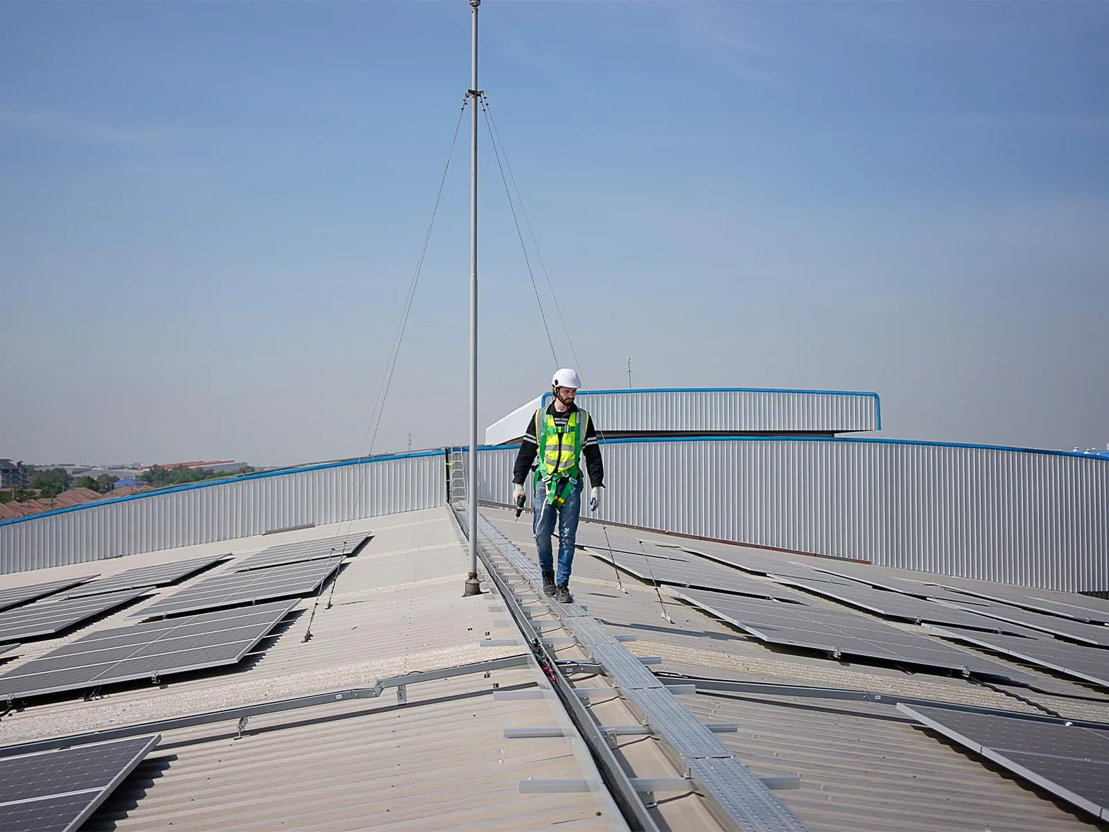 Fall protection system used in renewable energy facility for safe elevated access