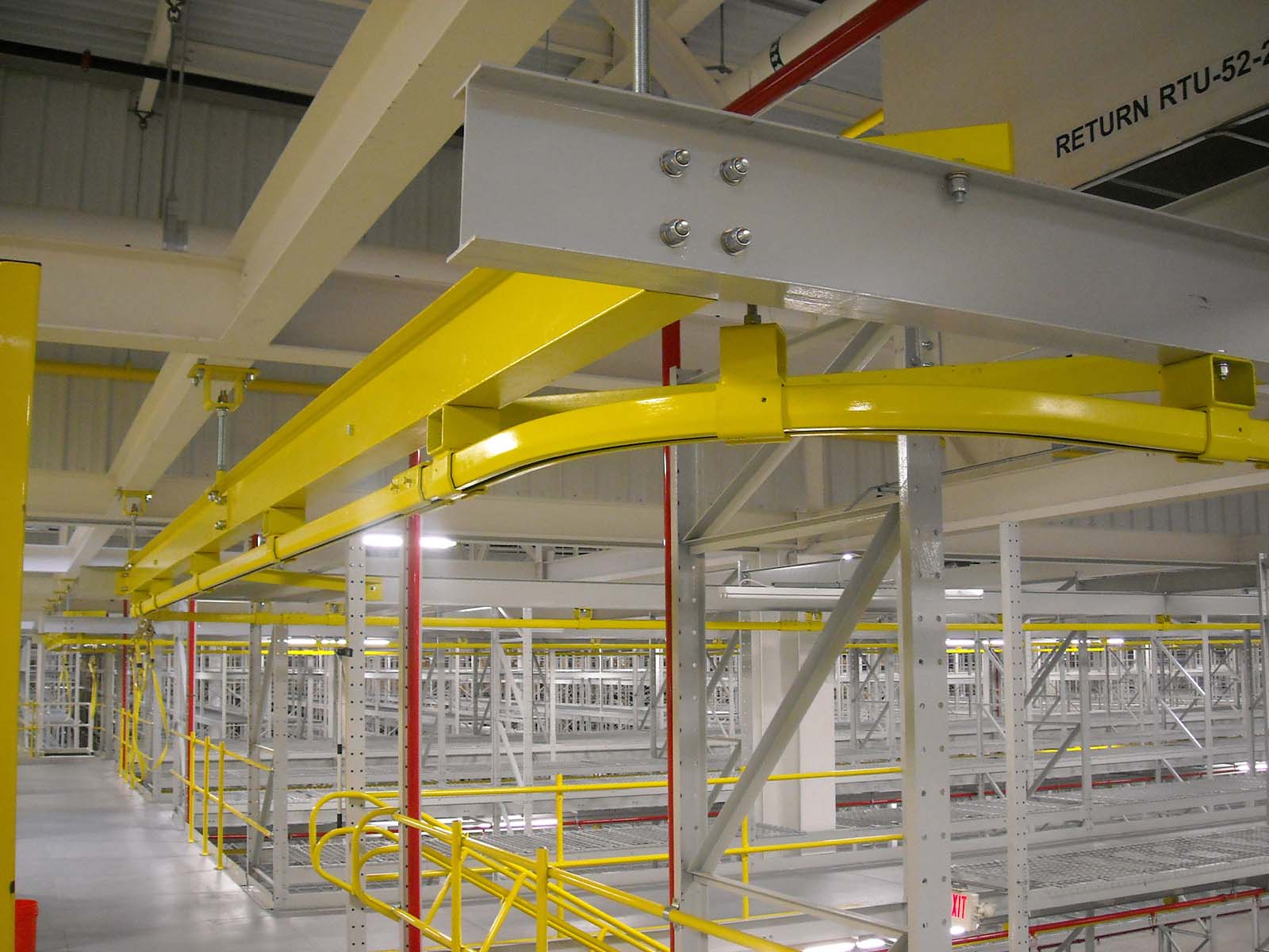 Engineered fall arrest system designed for warehouse shelving and elevated storage safety
