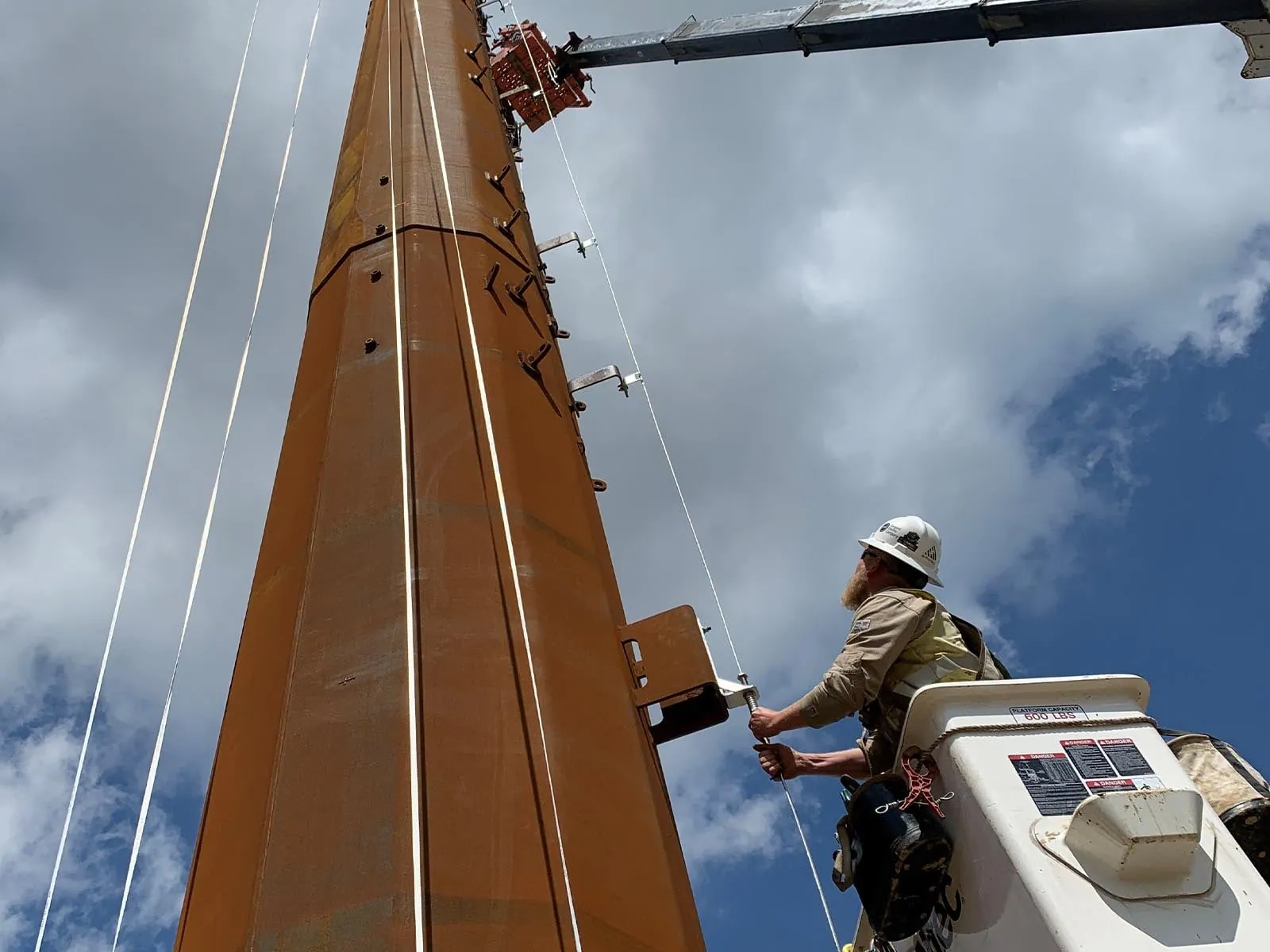 Fall protection system used for safe tower and utility pole climbing operations